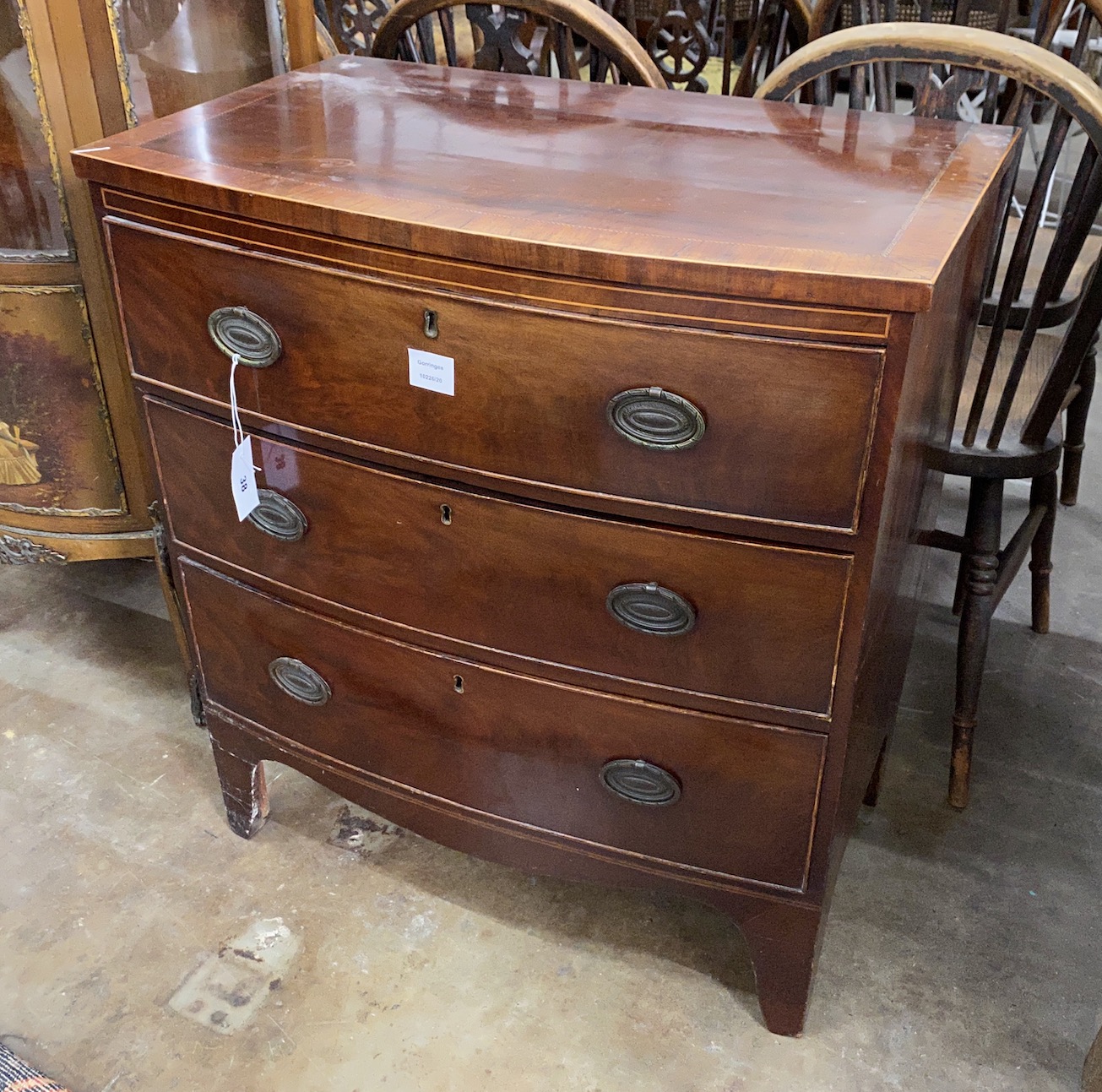 A small Regency banded and inlaid mahogany bow fronted chest of drawers, width 74cm, depth 45cm, height 81cm